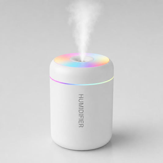 White mini humidifier, front view, with a fine mist rising